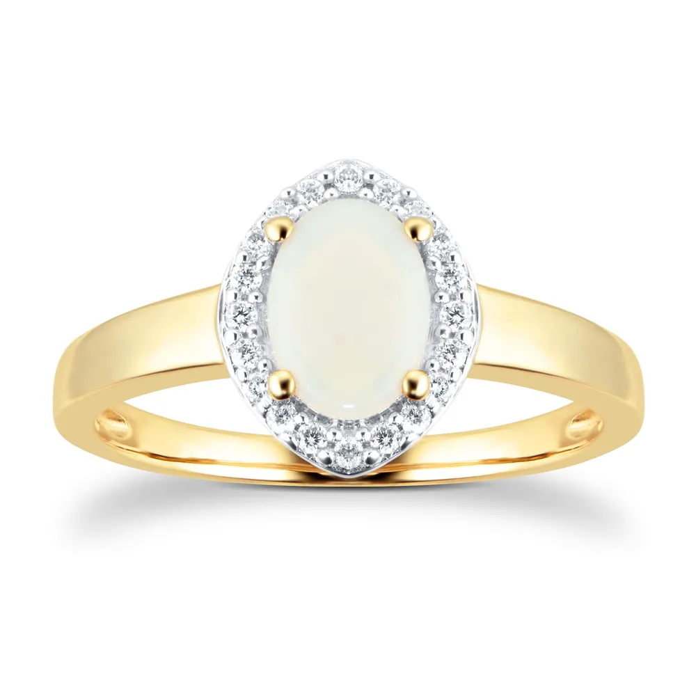 Oval Cut Opal And Diamond Set Ring In 9 Carat Yellow Gold