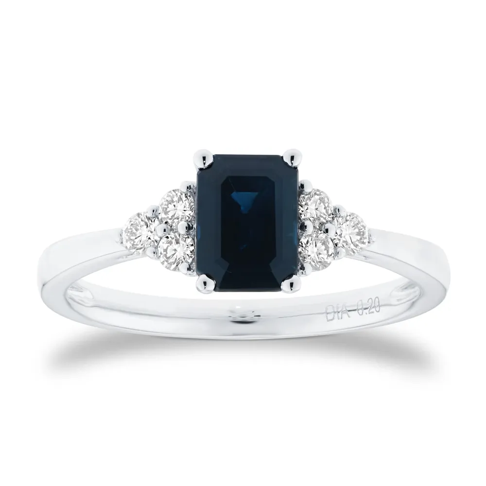 Platinum Emerald Cut Sapphire and 0.20cttw Diamond Three Stone Engagement Ring